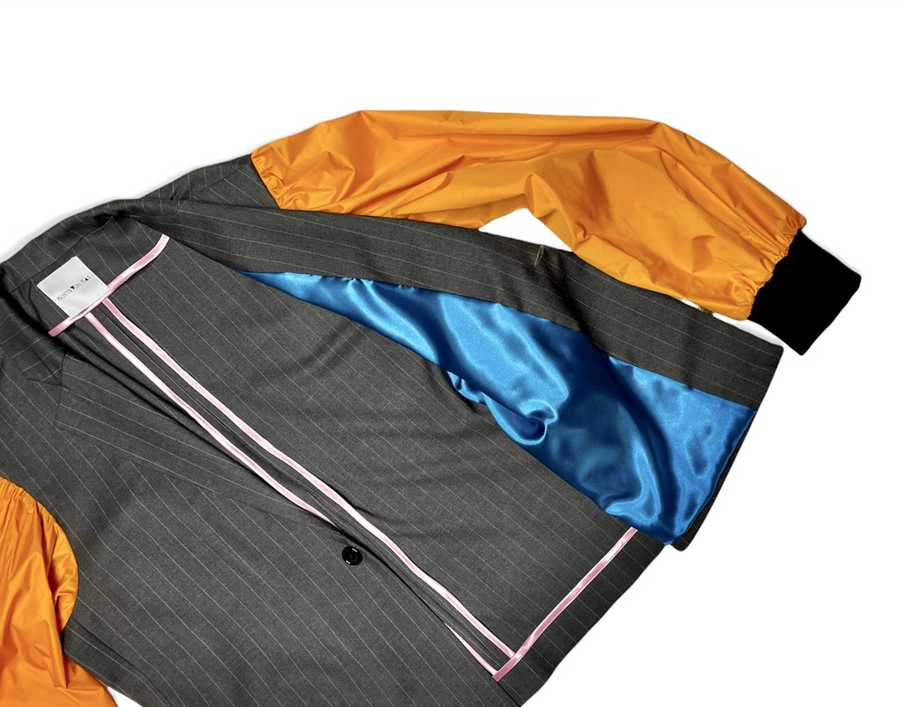 grey jacket with orange -fly jacket- sleeves